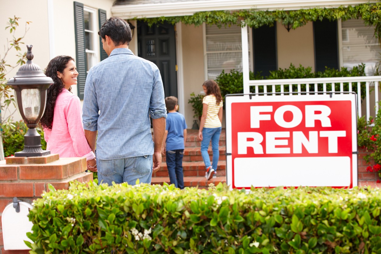 family-walking-into-rental-home