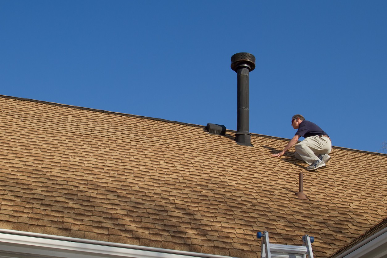 inspecting-roof-shingles