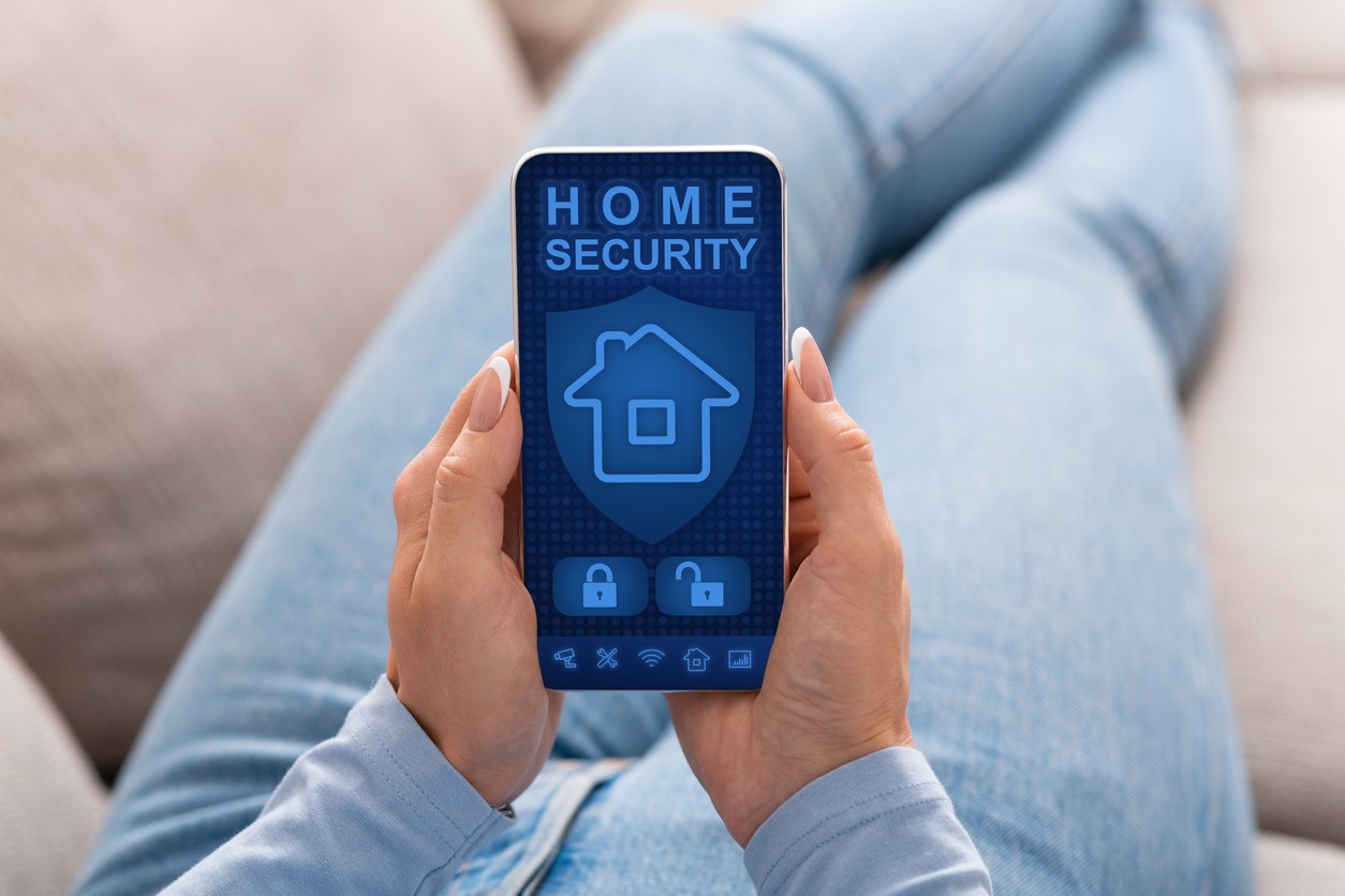 woman-with-home-security-app